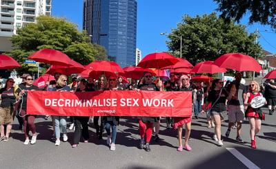 Decrim Qld members and supporters march in the 2023 Labour Day parade.